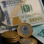 Dólar cai a R$ 5,10 com Selic a 14%; Ibovespa recua